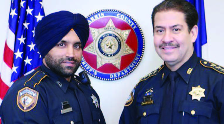 Deputy Sandeep Singh Dhaliwal and Sheriff Adrian Garcia