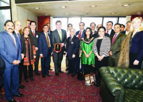 The Indian delegates were received by Boston Mayor Martin J. "Marty" Walsh, displaying the plaque that was presented to him by the Consul General of India Mr. Mulay, who is seen to the right of the Mayor.