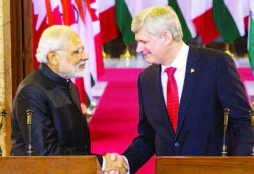 Prime Minister of Canada Stephen Harper and Narendra Modi, Prime Minister of India, shake hands following a joint press conference in Centre Block on Parliament Hill.