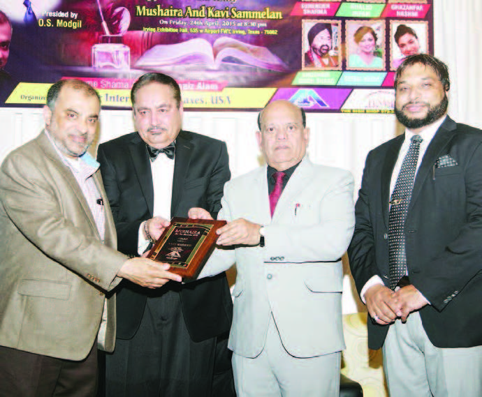 Chief Guest Nasir Mehmood is receiving Unity Award . Others in the picture- President O.S. Modgil, and Noor Amrohvi