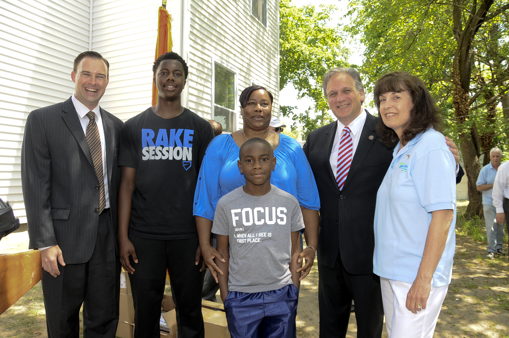 At the dedication of 17th home. Pictured (left to right): Mike Pfeiffer, Executive Director, Habitat for Humanity; Terryl, Michelle and Jahkobe Walden; County Executive Mangano; and Madeline Squeglia, President of Habitat for Humanity