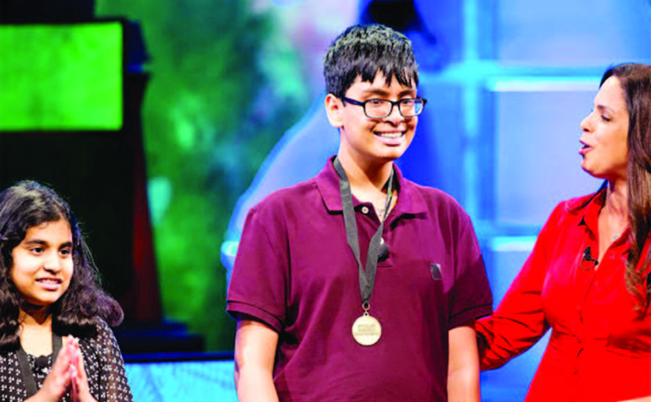 Karan Menon, 14 wearing the medal (center) from New Jersey is the 2015 National Geographic Bee champion.