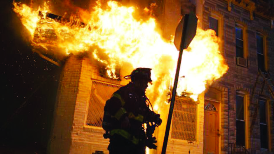 Police and firefighters respond to a building that caught fire on April 27th night