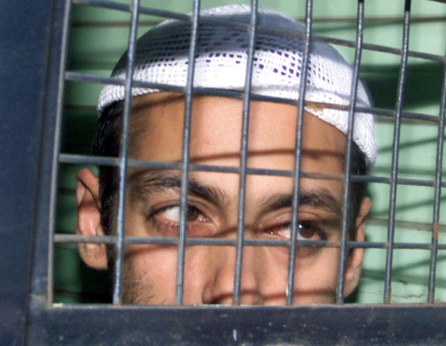 Salman Khan is seen seated inside a police van at Mumbai Sessions Courts which announced five years jail sentence to the actor in a 2002 hit and run incident in which one person was killed