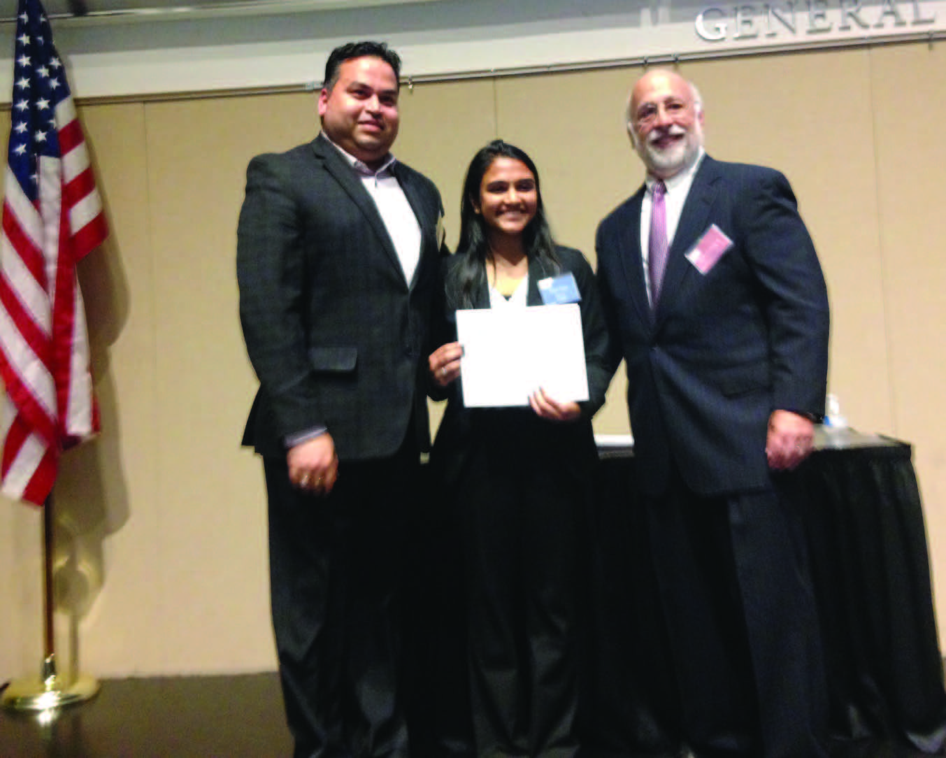 GOPIO-CT Scholarship recipient Priya Gad receiving the scholarship award at the UConn Stamford Campus on June 1, 2015. Seen in the picture, from L to R: GOPIO-CT President Shelly Nichani, Priya Gada and Stamford Dollars for Scholar President Garry Freeman.