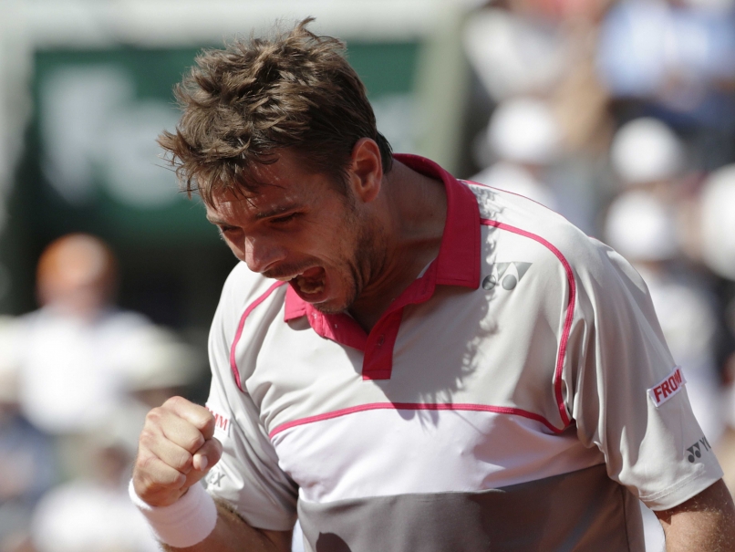 Stanislas Wawrinka exults after beating Djokovic AFP Photo