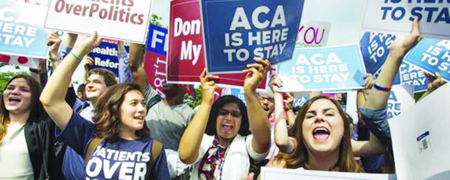 Supporters of the Affordable Care Act cheer outside the Supreme Court June 25 after the court threw out the challenge to the reach of the law.