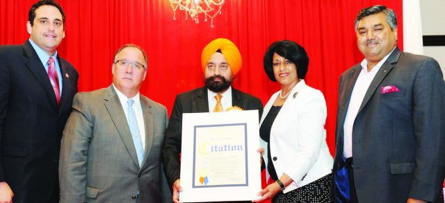 Town of Hempstead Town Clerk Nasrin Ahmad presents a citation to IALI President Satnam Singh Parhar