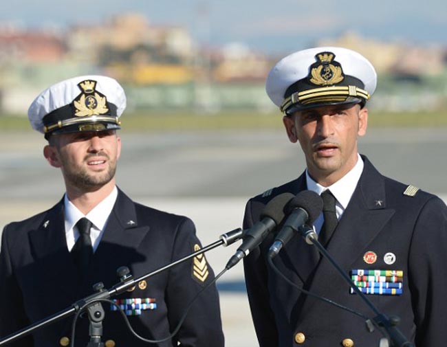 Italian marines Massimiliano Latorre (R) and Salvatore Girone (L) speak to the press at Ciampino airport near Rome, on December 22, 2012. AFP PHOTO/ VINCENZO PINTO