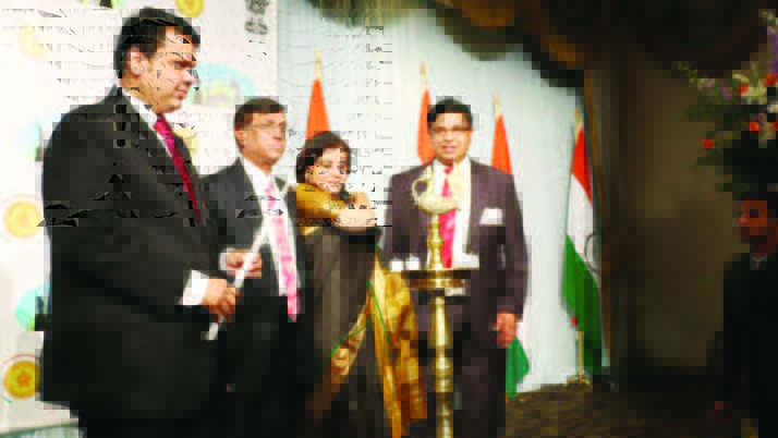 Maharashtra Chief Minister Devendra Phadnavis (left) is ready to light thelamp at the beginning of the function. Also seen in the picture, from left to right, are Consul General Dnyaneshwar Mulay, Mrs. Sadhna Shanker, and chief of Maharashtra Mandal Photos/Gunjesh Desai -Masala Junction