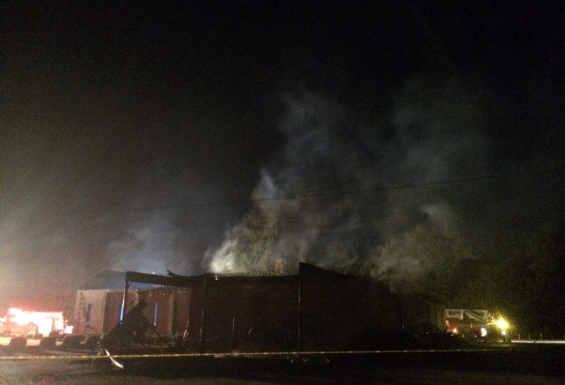 Smoke rises from Mount Zion African Methodist Episcopal church Wednesday, July 1, 2015, in Greeleyville, S.C., which caught fire Tuesday. The African-American church that was burned down by the Ku Klux Klan in 1995 caught fire again Tuesday night. (Veasey Conway/The Morning News via AP)