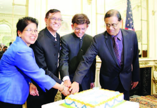 Celebrating India's birthday. India's Consul General Dnyaneshwar M Mulay (second from left) cuts the cake