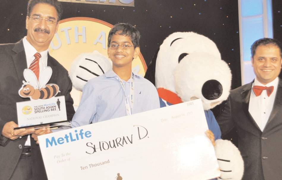 At the check presenting ceremony. ( L to R): MetLife Representative, Chander Sharma, National Champion Shourav Dasari along with MetLife mascot Snoopy and Founder Rahul Walia