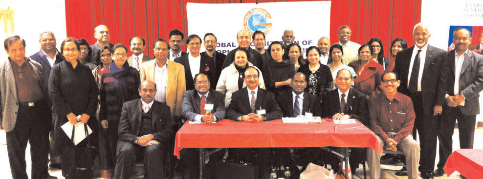 Speakers, organizers and some participants at the recently held community meeting on NRI Property Issues in India. Seated in front row, from L. to R.: Kerala Center President Thambi Thalappillil, GOPIO Founder President Dr. Thomas Abraham, GOPIO-New York President and panelist Anand Ahuja, Panelist Pambayan Meyyan, GOPIO-New York Founder President Lal Motwani and Kerala Center Executive Director E.M. Stephen