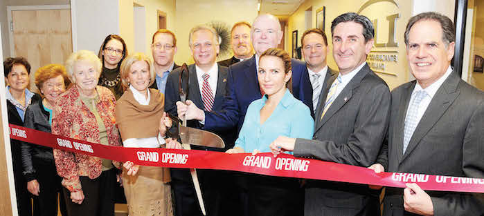 Pictured at the grand opening, from L to R: Raffaella Marciari Assistant Vice President for Chase and Chamber of Commerce member, Diane S. Harragan Licensed Real Estate Broker with Coach Realtors and Chamber of Commerce member, Katie Miller of the Chamber of Commerce, Valerie Trubnik MD of OCLI, Nancy Morris of State Farm who is past president of the Chamber of Commerce, Roy Smitheimer Deputy Director of the North Hempstead Business and Tourism Development Office, Nassau County Executive Edward P. Mangano, Father Robert Romeo-Pastor of St. Mary's, Robert Broderick M.D. of OCLI, Deborah Coco Office Manager and Surgical Coordinator, Tom Burke Chief Executive Officer of OCLI, North Hempstead Town Clerk Wayne Wink and North Hempstead Receiver of Taxes Charles Berman.