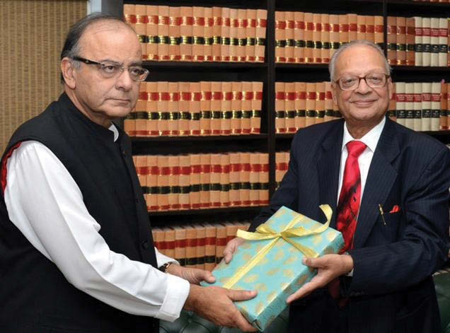 Union Finance Minister Arun Jaitley receives the Seventh Pay Commission Report from the chairman, Ashok Kumar Mathur, in New Delhi.