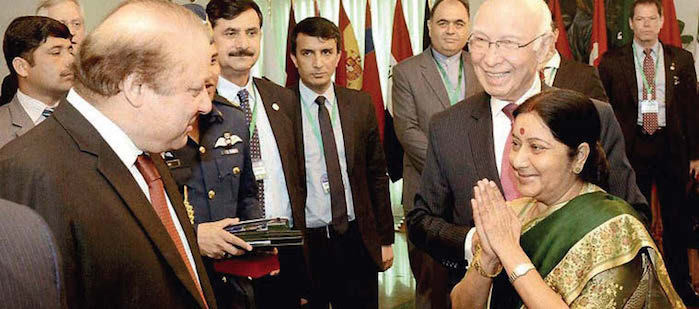 Sushma Swaraj with Nawaz Sharif and Sartaj Aziz in Islamabad on December 9.