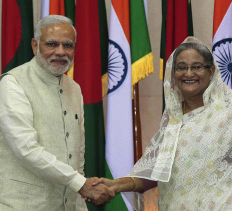 Prime Minister Narendra Modi and Bangladesh Prime Minister Sheikh Hasina shake hands in Dhaka, Bangladesh, Saturday, June 6, 2015.