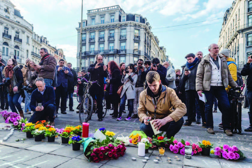 Paying homage with flowers and candles to the fallen in Terrorist attack in Brussels
