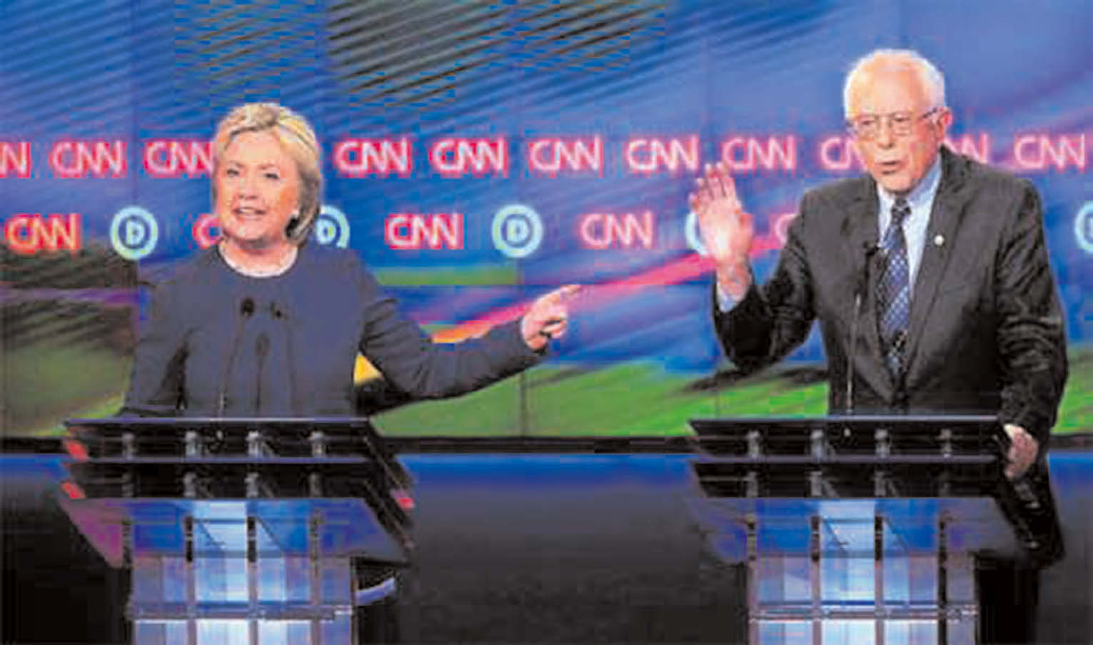 Democratic presidential candidate Senator Bernie Sanders (right) and Democratic presidential candidate Hillary Clinton speak during the CNN Democratic Presidential Primary Debate at the Cultural Center Campus, Michigan