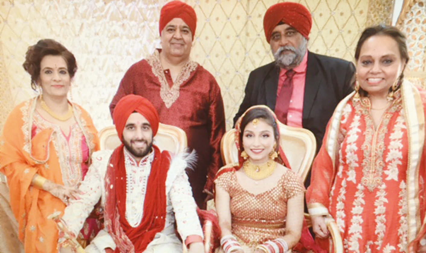 The newlyweds Pavneet and Sahil (seated) with their parents. Standing, L to R: Mrs. Homa Mehra, Mr. Parvesh Mehra, Mr. Mohinder S Taneja and Mrs. Dimpy Taneja