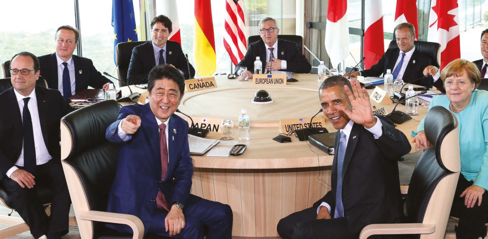 Japanese Prime Minsiter Shinzo Abe, foreground center left, and U.S. President Barack Obama, foreground center right, smile at photographers with other leaders of Group of Seven industrial nations, clockwise from left, French President Francois Hollande, British Prime Minister David Cameron, Canadian Prime Minister Justin Trudeau, European Commission President Jean-Claude Juncker, European Council President Donald Tusk, Italian Prime Minister Matteo Renzi and German Chancellor Angela Merkel, at the start of the second working session of the G-7 summit meetings in Shima, Mie Prefecture, Japan, Thursday, on May 26, 2016. (AP)