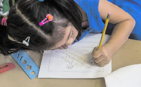 A girl enjoying drawing