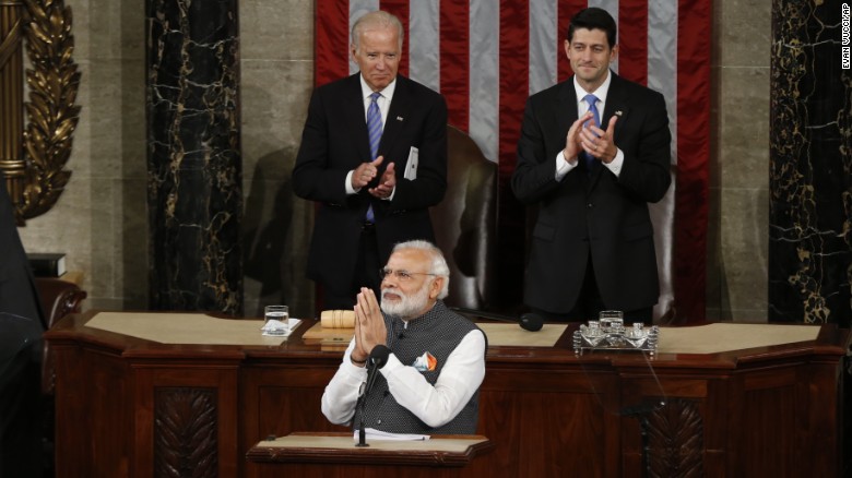 PM Modi greets the gathering as he arrives at the podium to address US Congress. Seen behind him are the US Vice President Joe Biden and House Speaker Paul Ryan.