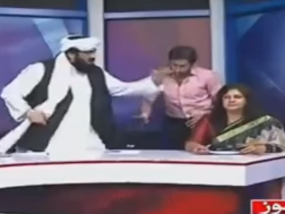 Pakistani senator Hafiz Hamdullah (left) gesticulates during a heated panel show debate about honour killings YouTube
