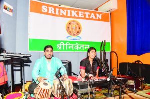 Sudipta sings a bhajan. Sudeep is on Tabla