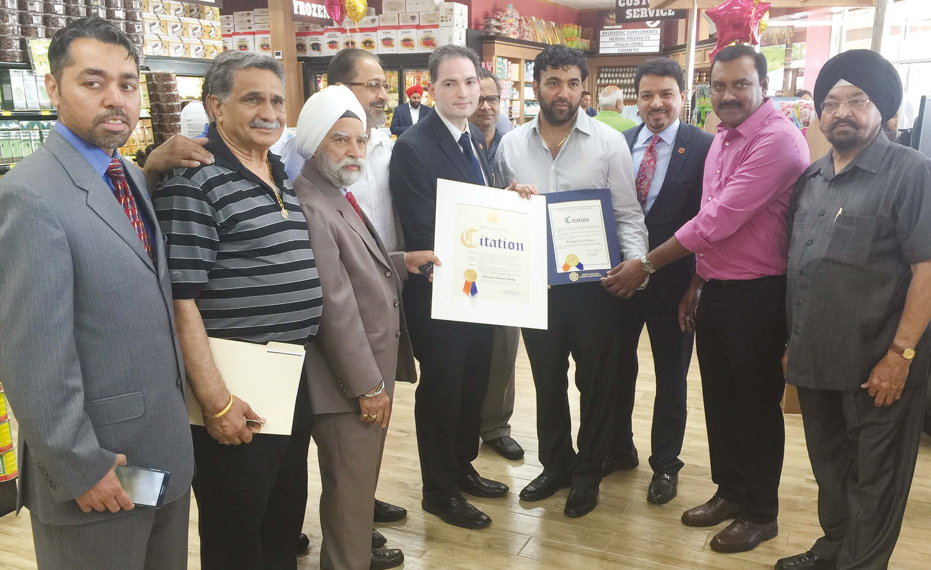 Mr. Dilip Chauhan, Director with Nassau County Comptroller's Office, presenting a citation to Amandeep Singh Toni, on behalf of Nassau County.