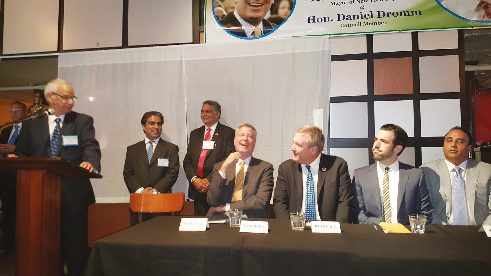 Mayor Bill de Blasio bursts in to laughter at a comment of Mr. Shiv Dass. Also seen are Harry Singh Bolla (extreme right) and Daniel Dromm