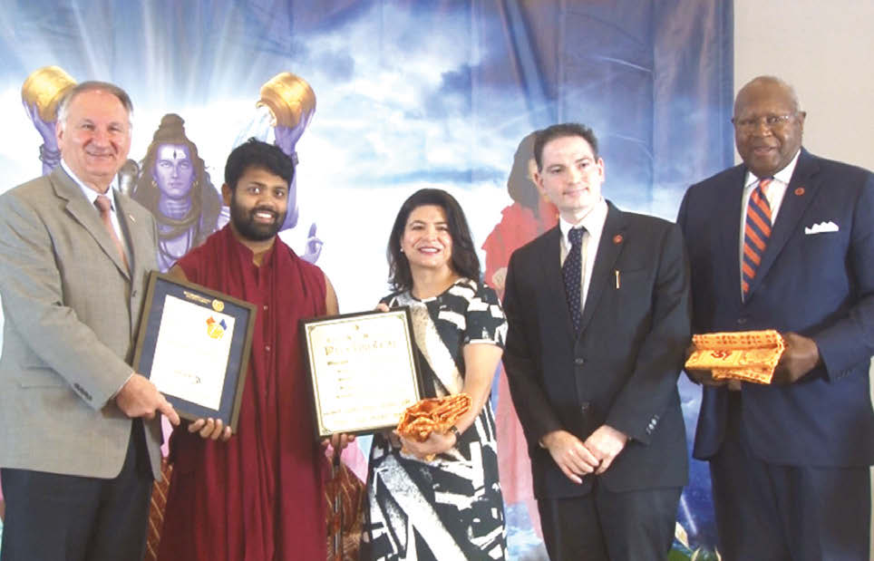 At the Ceremony of Declaration of June 18th as Baba Shivanand Day in the Town of North Hempstead, Long Island, New York. Seen in the picture, from left to right: Comptroller George Maragos, Acharya Ishan ShivanandJi with Proclamation, Councilwoman Ana Kaplan, Director of Southeast/Asian Affairs Dilip Chauhan, Deputy Comptroller James Garner