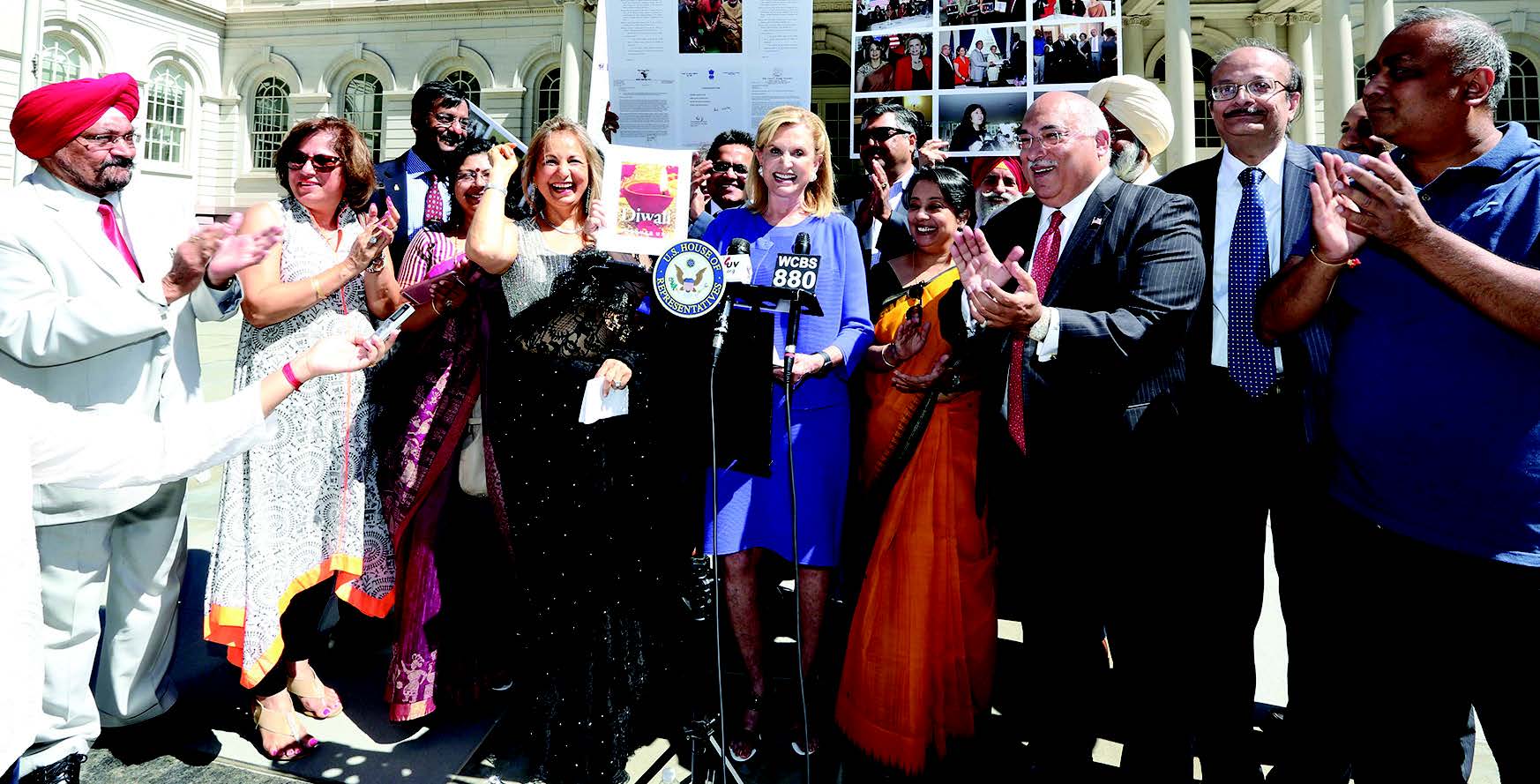 Congresswoman Carolyn Maloney and Diwali Stamp Project Chairperson Ranju Batra announced that the Diwali Stamp will be unveiled on October 5 at the Indian Consulate. Seen in the picture, from L to R: Prof. Indrajit Saluja, Neeta Bhasin, Rajeev Sharma, Vandana Sharma, Regional Manager Air India, Ranju Batra, Congresswoman Carolyn Maloney, Kamlesh Mehta, Consul General Riva Ganguly Das, Pal Dhillon, Ravi Batra, Harpreet Singh Toor, Sudhir Vaishnav, Srujal Parikh -- Photo/ Mohammed Jaffer-SnapsIndia