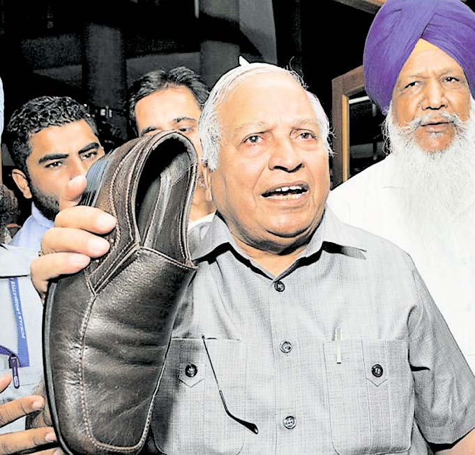 Minister Madan Mohan Mittal showing the shoe thrown by Congress MLA Tarlochan Singh Soondh towards treasury benches inside the House, at the Punjab assembly in Chandigarh on September 14 . Photo source: HT