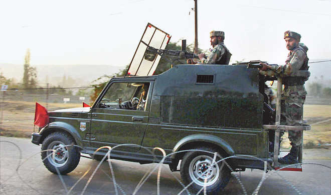 Cost of sub conventional war: Soldiers move around during an encounter with the militants after the recent attack on an Army base camp in Baramulla district of north Kashmir.