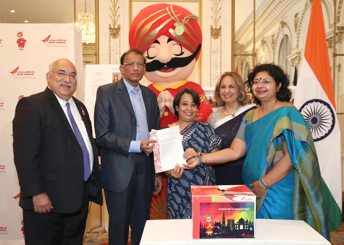 HR Shah wins Air India free return ticket. Seen in the picture, from L to R: Ravi Batra, HR Shah, Ambassador Riva Ganguly Das, Ranju Batra, Vandana Sharma, Regional Manager, Air India