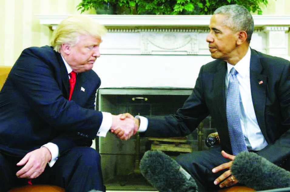 U.S. President Obama greets President-elect Trump in the White House Oval Office in Washington, November 10.