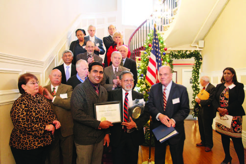 Harbachan Singh (center, holding plaque in left hand) with Democratic leaders