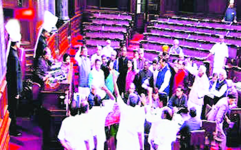 Members protest in the well of the Rajya Sabha in New Delhi on Thursday, Feb 9. Photo courtesy PTI