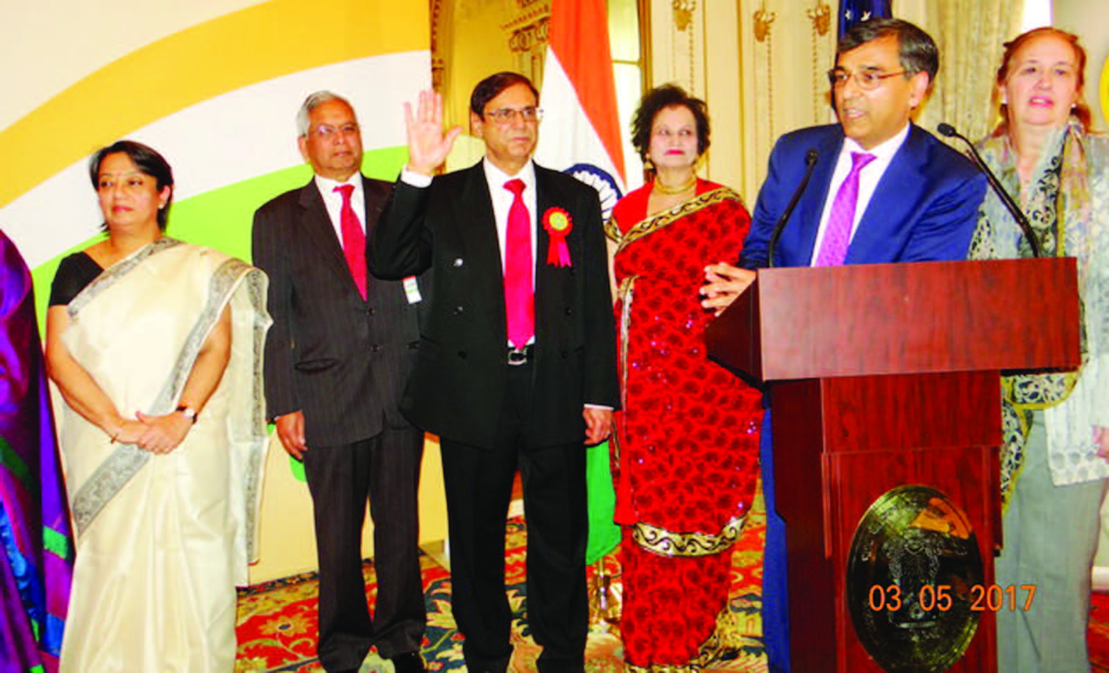 Gobind Munjal (with raised right hand) is sworn in by the immediate Past President Mr Sunil Modi (at the mike). From L to R: Consul General Riva Ganguly Das, Shashi Shah, Gobind Munjal, Mrs. Munjal, Sunil Modi, and Manhattan Borough President Gale Brewer