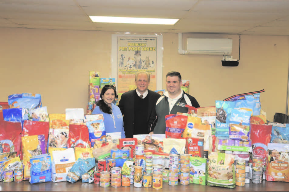 From left to right: Dr. Jessica Rosati, Chief Program Officer; Nassau County Executive Edward P. Mangano; and Billy Gonyou, Manager of the LI Cares February Food Drive