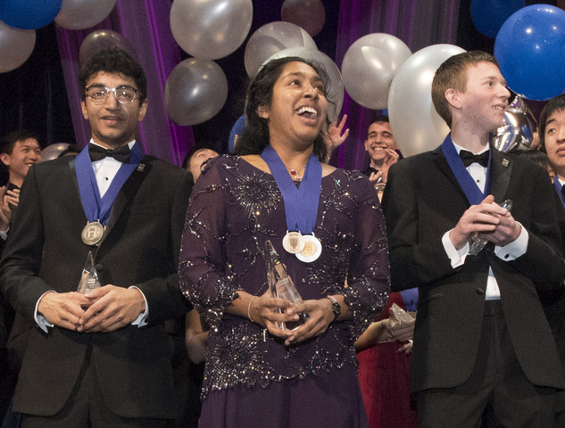 Indrani Das, 17, of Oradell, New Jersey, wins top prize and $250,000 in Regeneron Science Talent Search. Also pictured are Aaron Yeiser (left), 18, of Pennsylvania, who won 2nd Place and $175,000, and Arjun Ramani (right), 18, of Indiana, who won 3rd Place and $150,000. Photo Credit: Society for Science & the Public