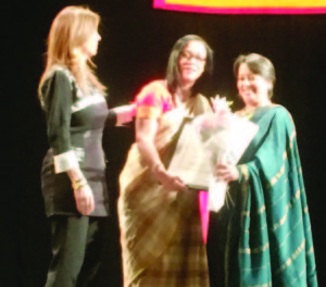 Malini Shah receiving the citation from SOFC President and Consul General of Columbia Maria Isabel Nieto (left) and India's Consul General Riva Ganguly Das