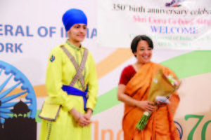 A young girl in Sikh traditional dress presented a bouquet on behalf of the community to Consul General Riva Ganguly Das