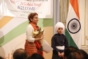 A young Sikh boy presented a bouquet on behalf of the community to Dr. Nikky Guninder Kaur Singh