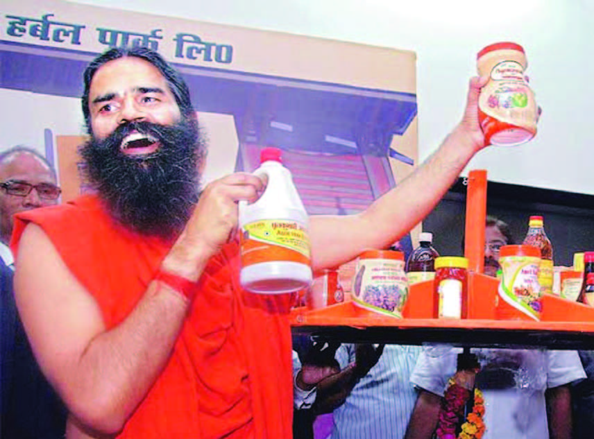 Baba Ramdev displays Patanjali products (Inset a bottle of rejected Amla juice)