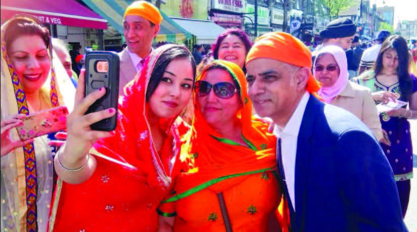 Sadiq Khan poses for selfies at the Baisakhi parade in Southall, London. Photo Courtesy: Twitter/@SadiqKhan