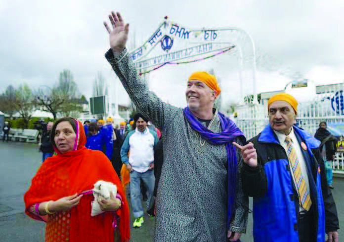 B.C. NDP Leader John Horgan waves to supporters at the Vaisakhi celebrations. Photo Courtesy:JASON PAYNE / PNG