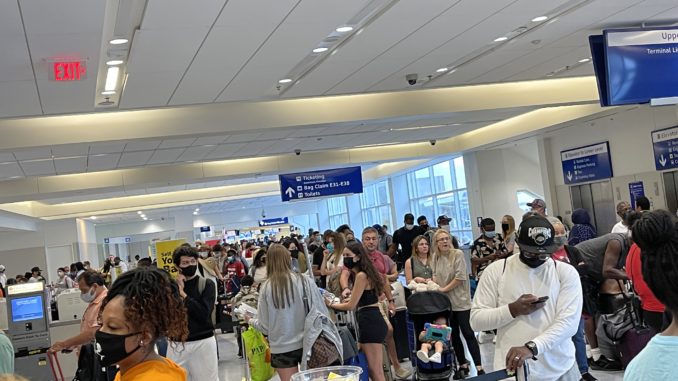 Travelers at Spirit Airlines counters at Dallas Fort Worth airport August 2